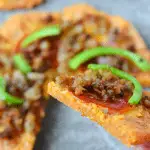 Better than Fat Head Pizza, this Low Carb Pizza fills you up at a fraction of the calories and carbs! The secret? Pork Rind Power! | heyketomama.com