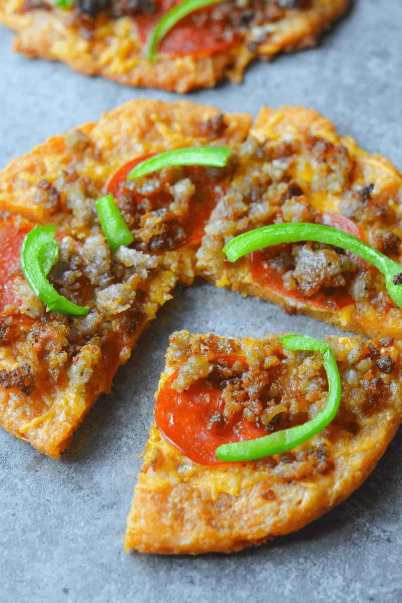 Better than Fat Head Pizza, this Low Carb Pizza fills you up at a fraction of the calories and carbs! The secret? Pork Rind Power! | heyketomama.com