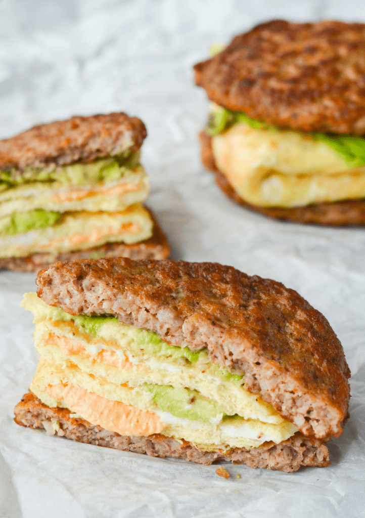My favorite keto breakfast sandwich is low in carbs, high in healthy fats and off the charts in flavor! The sausage on the outside is the perfect touch to make you not miss the bread at all! | heyketomama.com