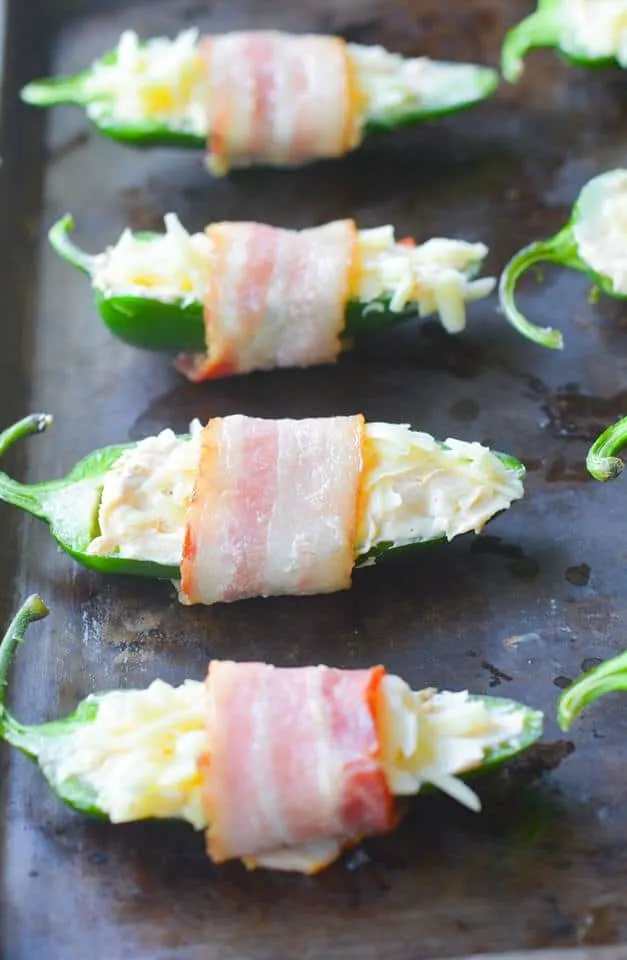 These Bacon Wrapped BBQ Jalapeno Poppers are an incredibly savory, flavorful low carb dish. Perfect to bring to any backyard BBQ, or to just enjoy at home! | heyketomama.com