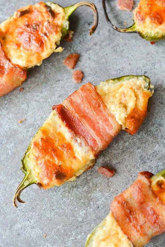 These Bacon Wrapped BBQ Jalapeno Poppers are an incredibly savory, flavorful low carb dish. Perfect to bring to any backyard BBQ, or to just enjoy at home! | heyketomama.com