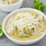 This Keto White Chicken Chili is an amazing comfort food for the changing seasons. It’s filling, tasty and can easily be a crockpot/freezer meal! | heyketomama.com