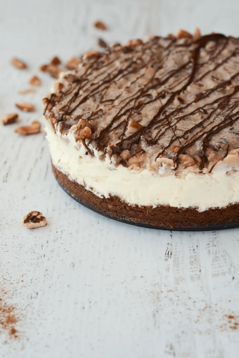 This Keto Pecan Pie Cheesecake is PERFECT for the Holiday Season. It's so delectable your non-low carb loved ones will never know the keto difference! | heyketomama.com