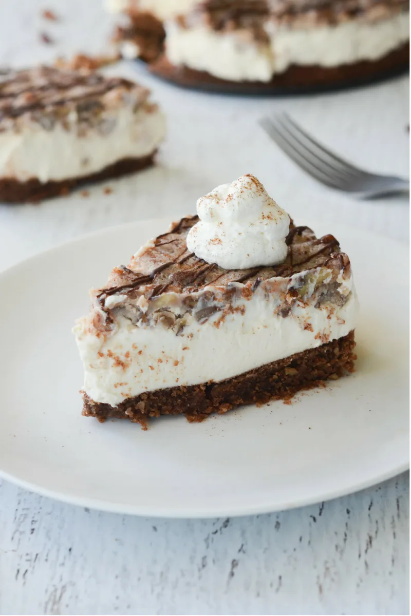 This Keto Pecan Pie Cheesecake is PERFECT for the Holiday Season. It's so delectable your non-low carb loved ones will never know the keto difference! | heyketomama.com