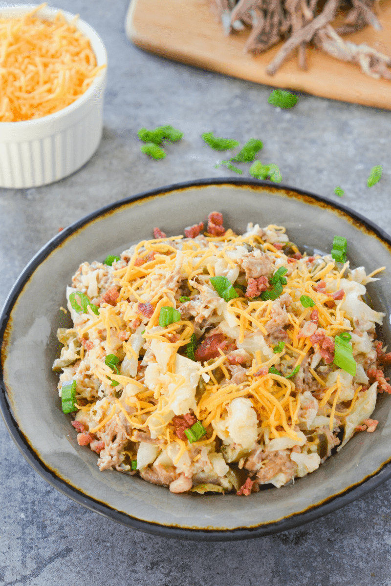 This loaded keto cauliflower bowl is a rich and flavorful, filling meal that will remind you of a baked potato!