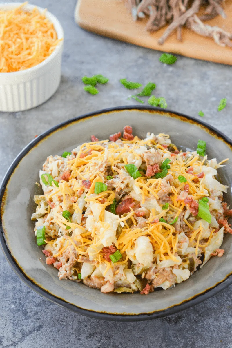 This loaded keto cauliflower bowl is a rich and flavorful, filling meal that will remind you of a baked potato!