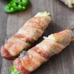 These Keto Spicy Artichoke Dip Jalapeno Poppers definitely raise the bar. They are an easy, delicious, one-way ticket to an incredible flavor adventure that you won't want to come back from anytime soon! | heyketomama.com