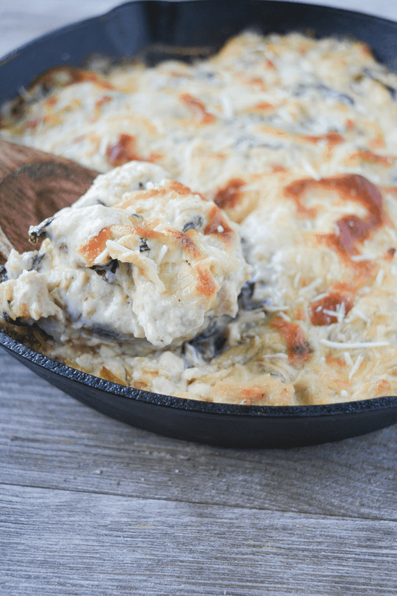 This Keto Spinach Artichoke Chicken Casserole is a rich and delightful meal your whole family will LOVE! This low carb recipe is a nice elevation of a classic appetizer. | heyketomama.com