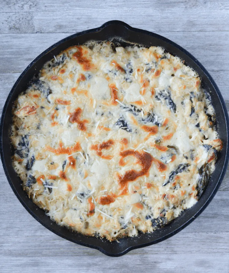 This Keto Spinach Artichoke Chicken Casserole is a rich and delightful meal your whole family will LOVE! This low carb recipe is a nice elevation of a classic appetizer. | heyketomama.com