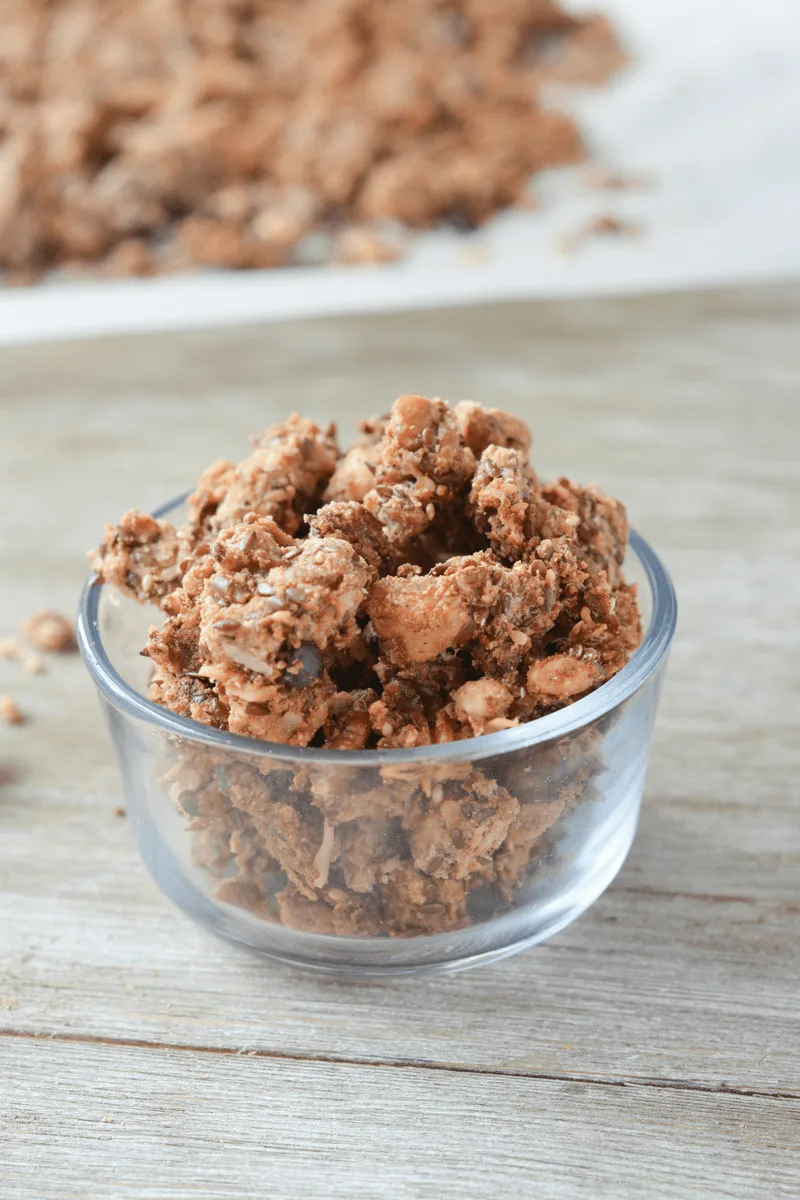 This Keto Cacao Coconut Granola is a delicious, low carb treat to satisfy your cravings for morning cereal, or just the perfect sweet and crunchy snack! | heyketomama.com