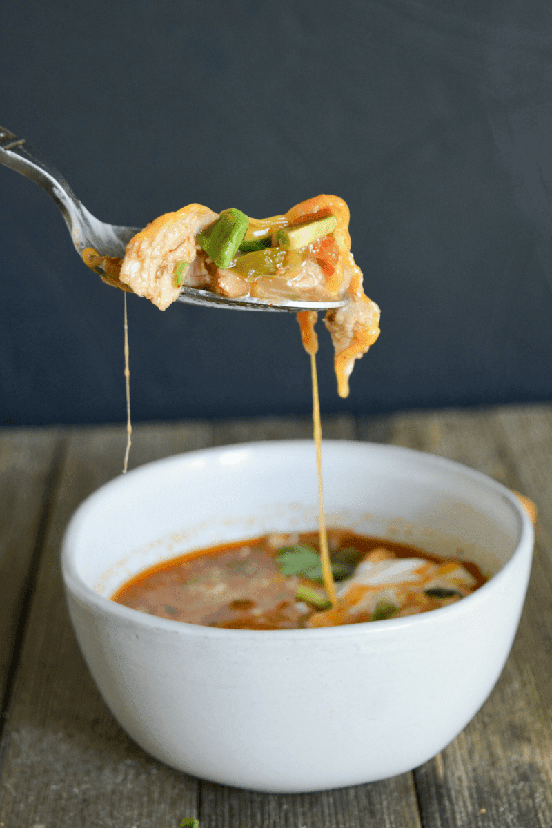 This Keto Chicken Taco Soup is your answer when the colder months ask what delicious dish you'll be warming yourself up with! It's easy, delicious, and full of low carb goodness! | heyketomama.com