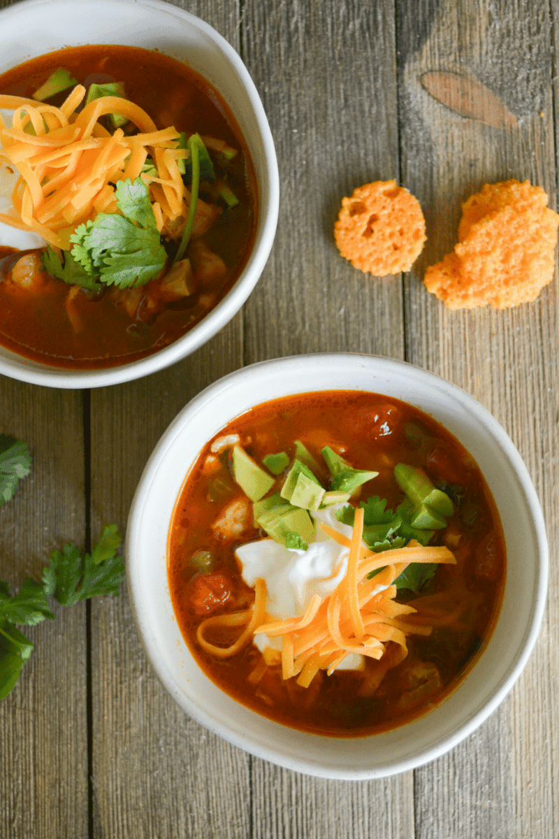 This Keto Chicken Taco Soup is your answer when the colder months ask what delicious dish you'll be warming yourself up with! It's easy, delicious, and full of low carb goodness! | heyketomama.com