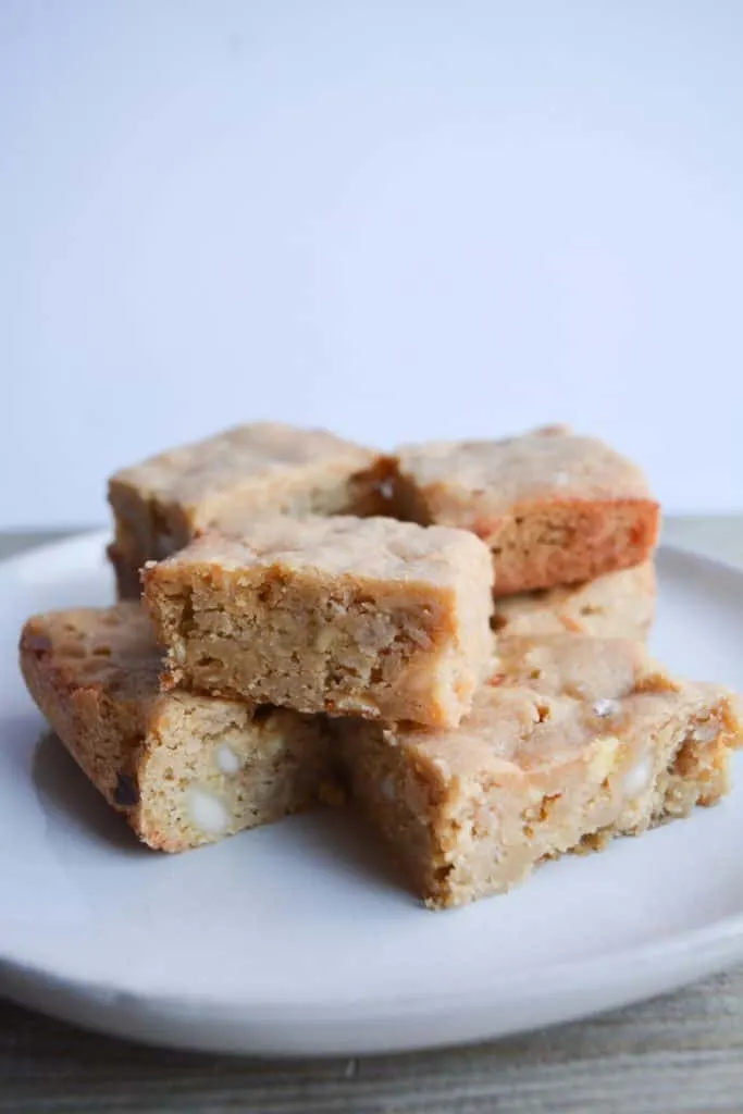 stack of several blondies on a white plate