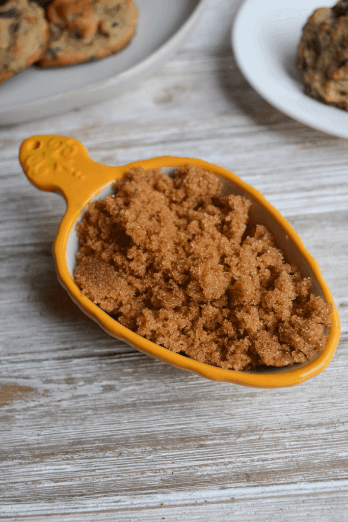 brown swerve in yellow measuring cup. i recommend using brown sweetener for keto chocolate chip cookies over white granular or powdered.