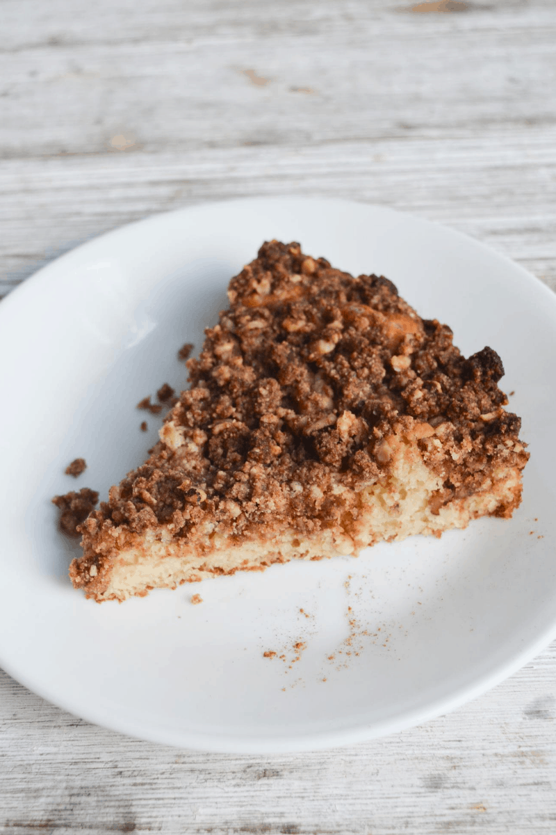 slice of keto coffee cake sitting on a white plate