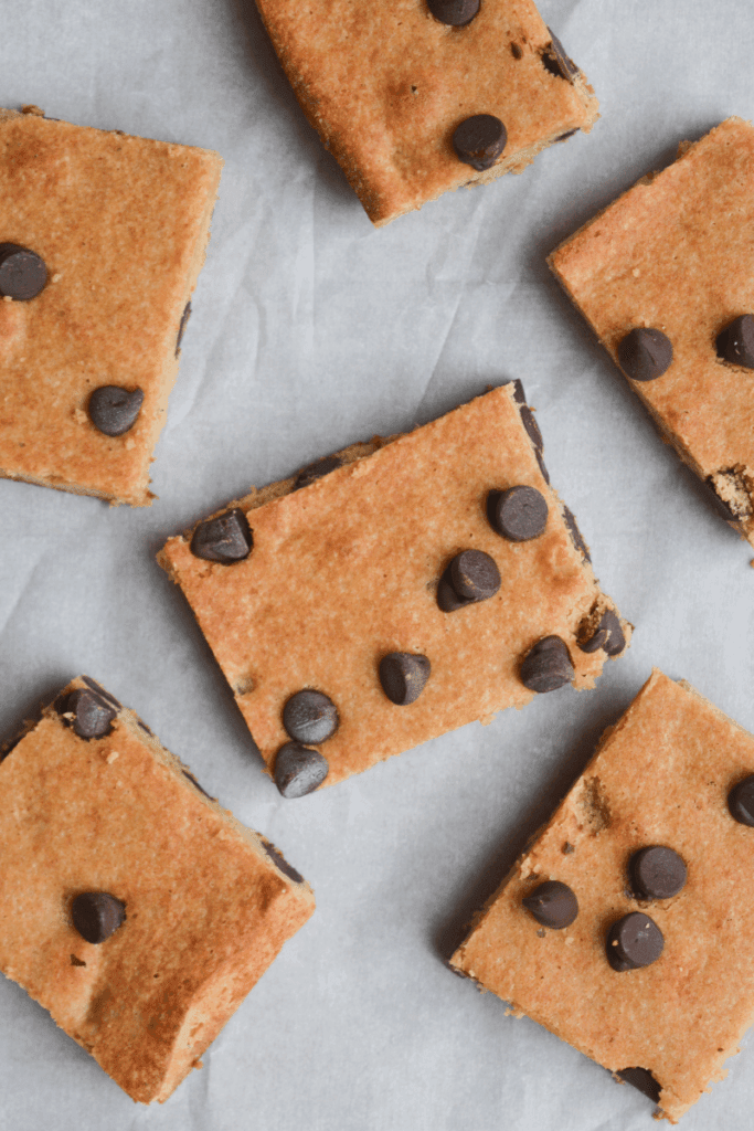 keto cookie bars spaced out on a piece of parchment paper