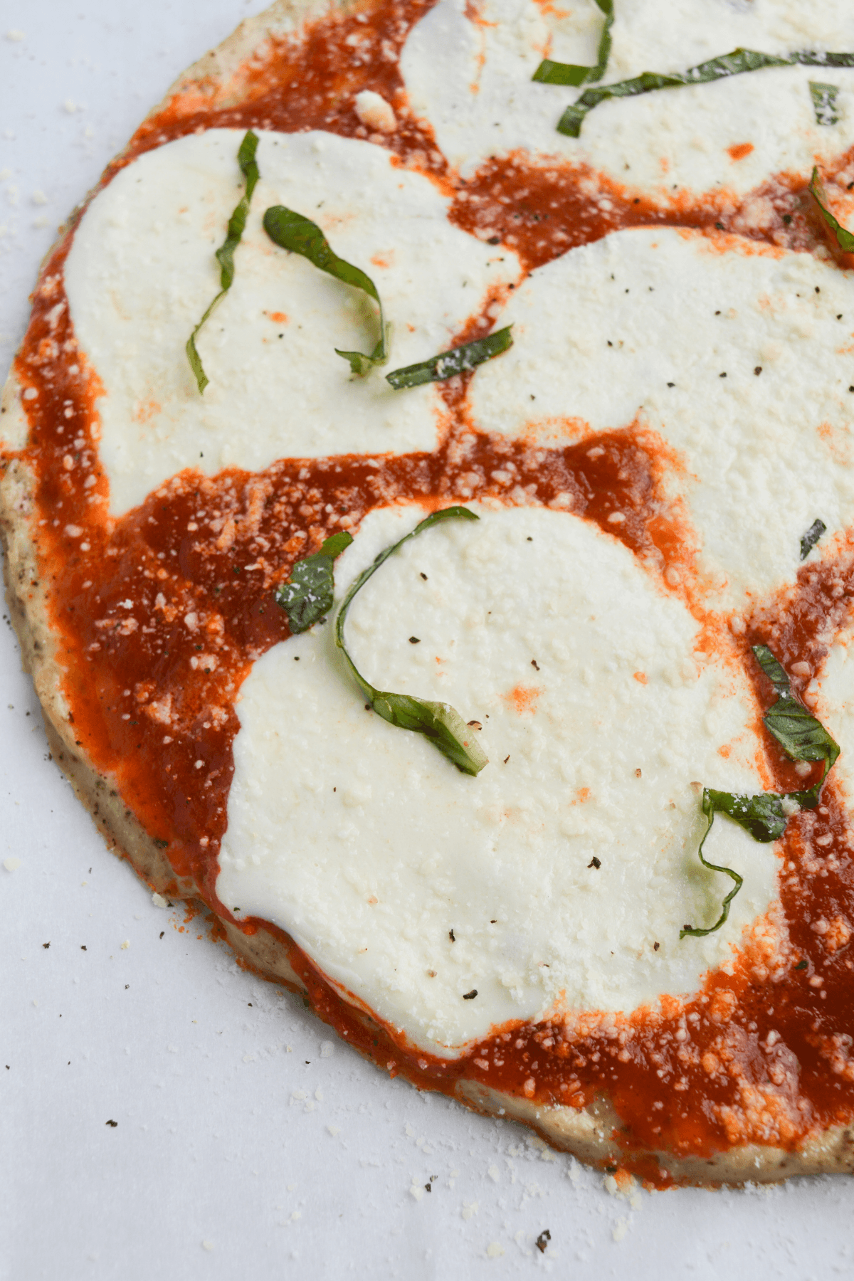 closeup of half of chicken parm pizza