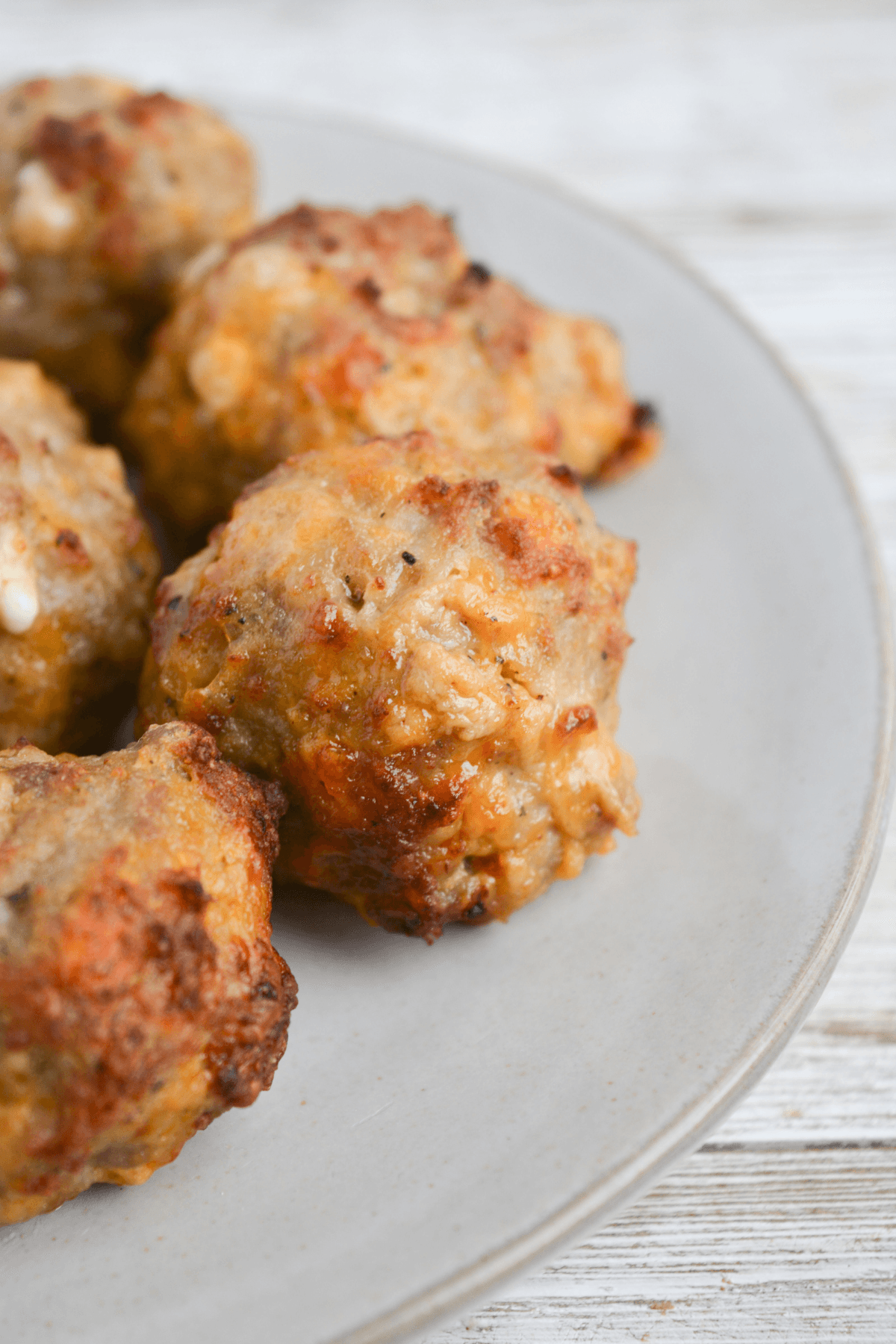 close up of sausage ball made in the air fryer on a plate