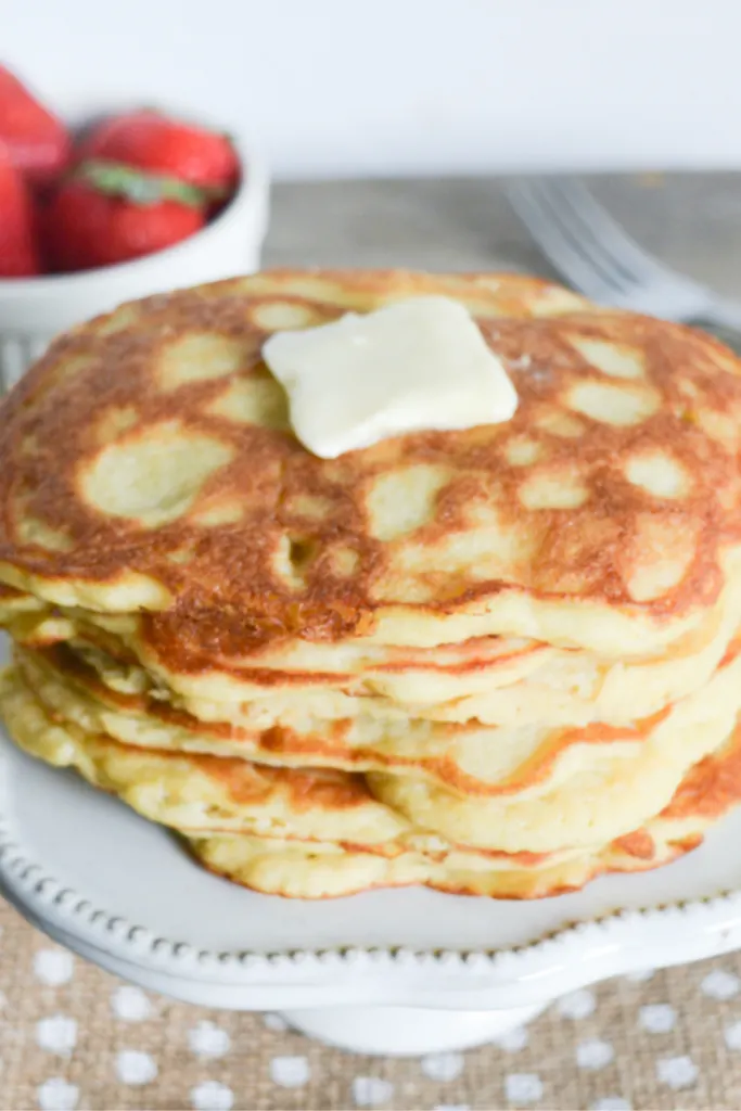 stack of keto pancakes, topped with a pat of butter