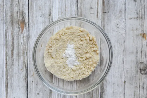 step three of making keto friendly fathead dough: mixing the almond flour and baking powder