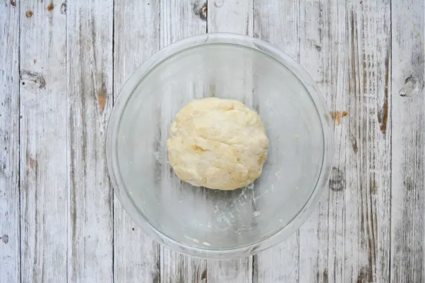 step four of making keto friendly fathead dough: mixing it all together into a ball