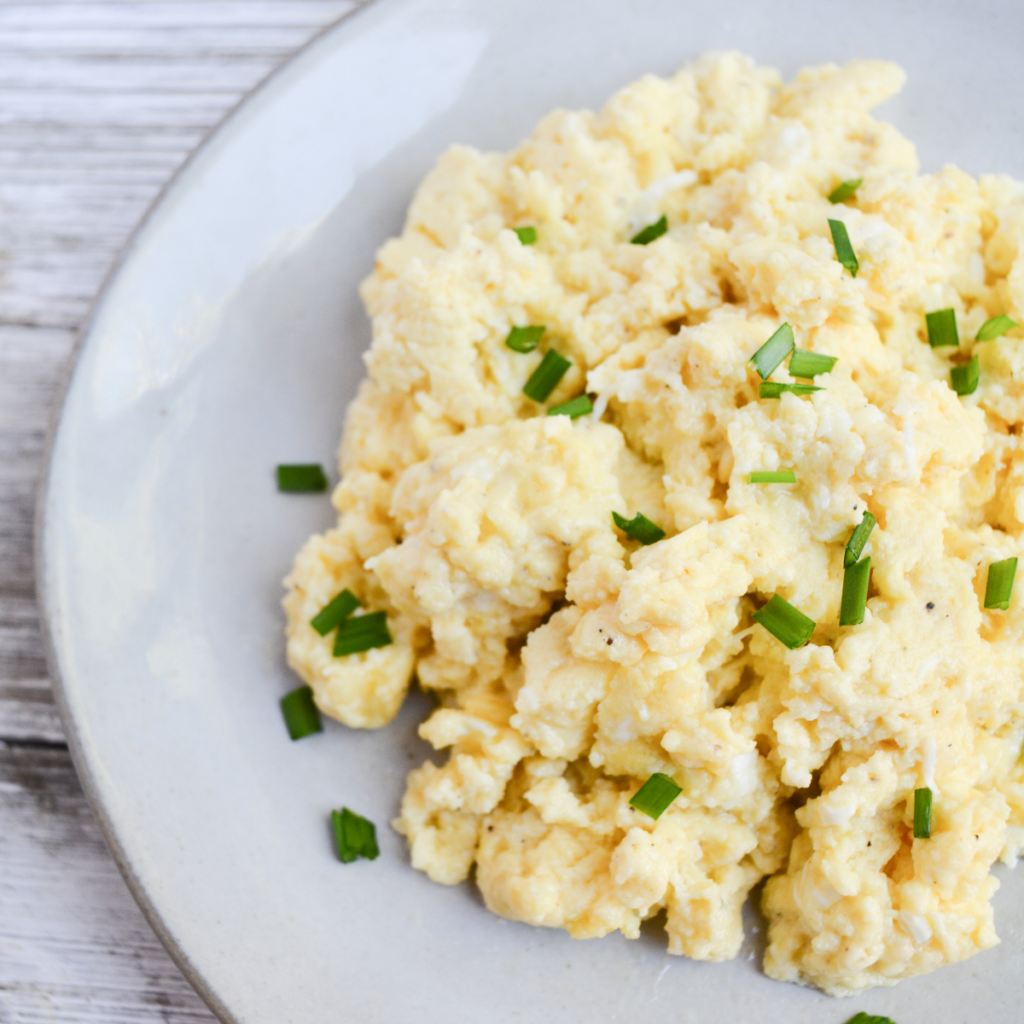 fluffy parmesan scrambled eggs step 3: removing eggs from heat and serving with a garnishing of choice