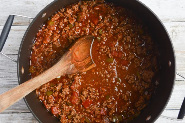 step five for cooking low carb chili: adding everything together and simmering