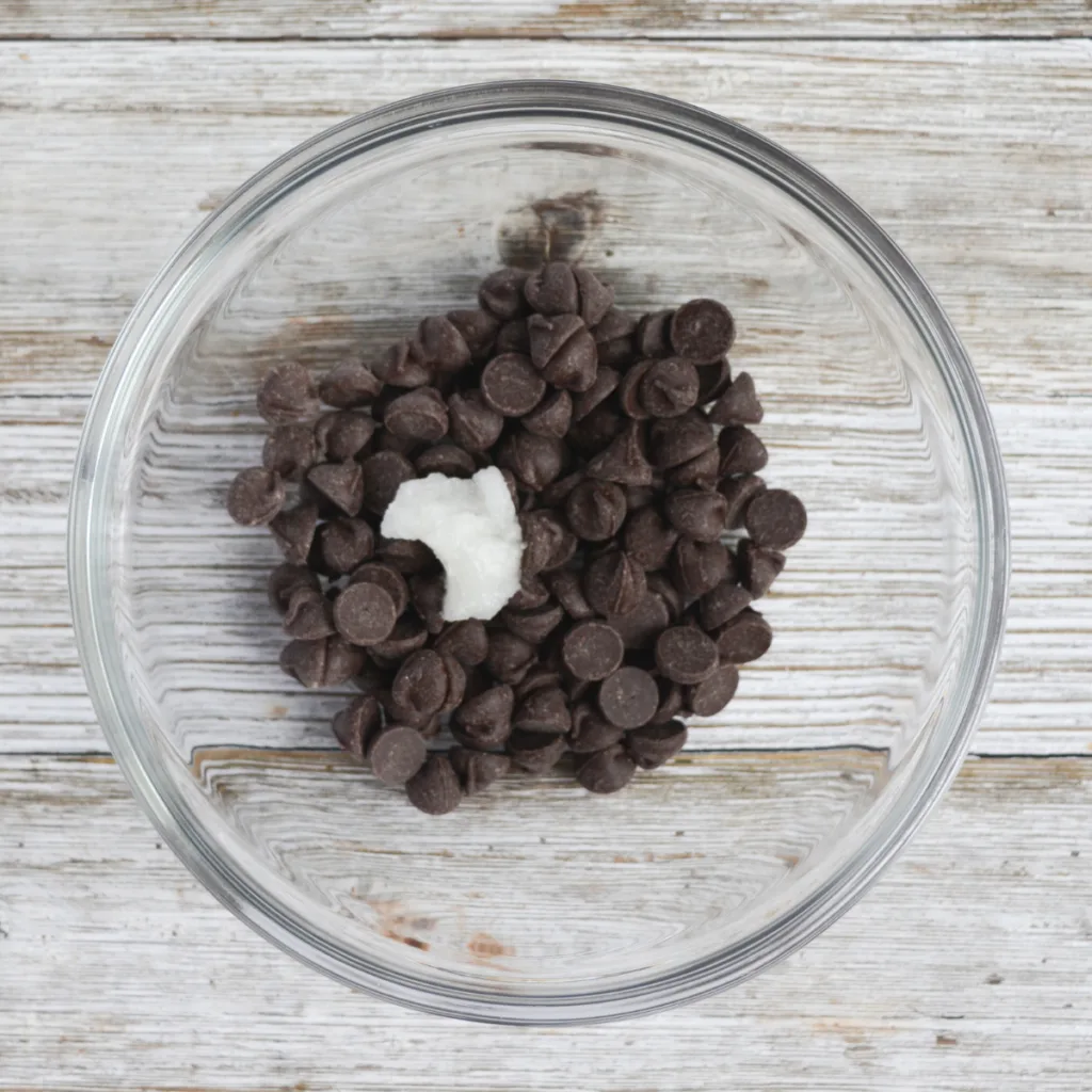 keto chocolate covered strawberries step two: melt together the coconut oil and chocolate chips