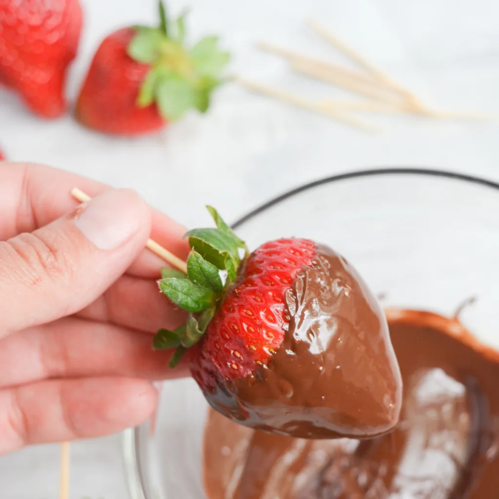 keto chocolate covered strawberries step three: dip the strawberries in the chocolate mixture