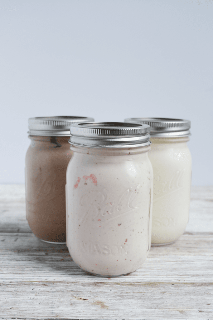 Three jars of keto mason jar ice cream, chocolate, strawberry and vanilla