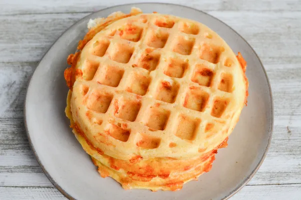 two cooled chaffles stacked on a palte