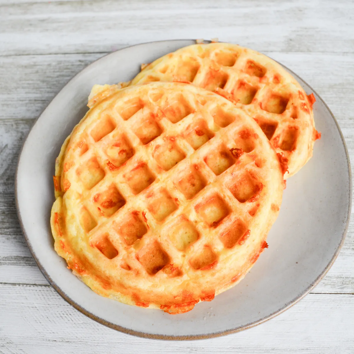 two keto chaffles sitting on a plate