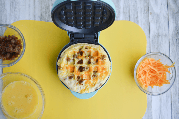 completely cooked waffle omelette, ready to be removed from the waffle iron.