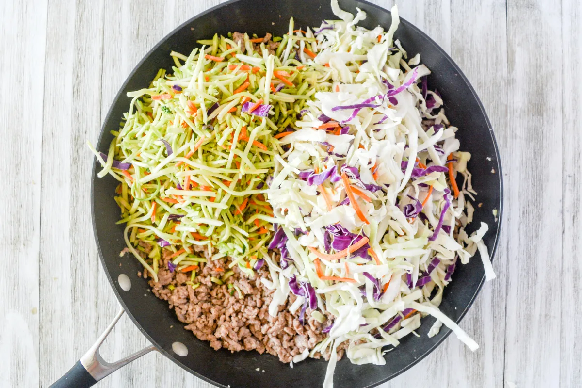 adding coleslaw mix and broccoli slaw.